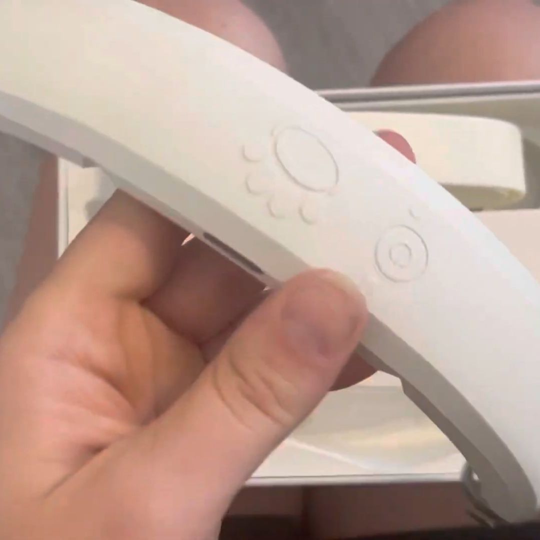 a human holding a halo collar