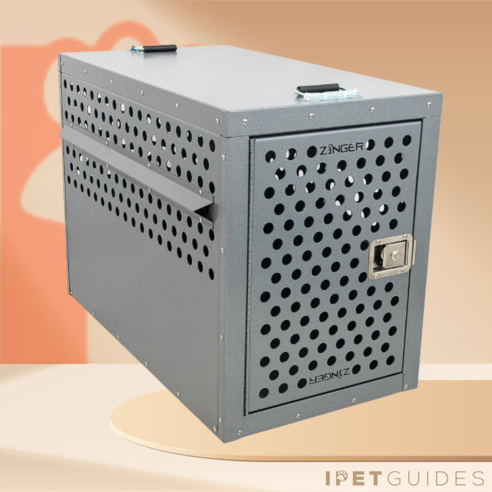 A grey dog crate with holes in it.
