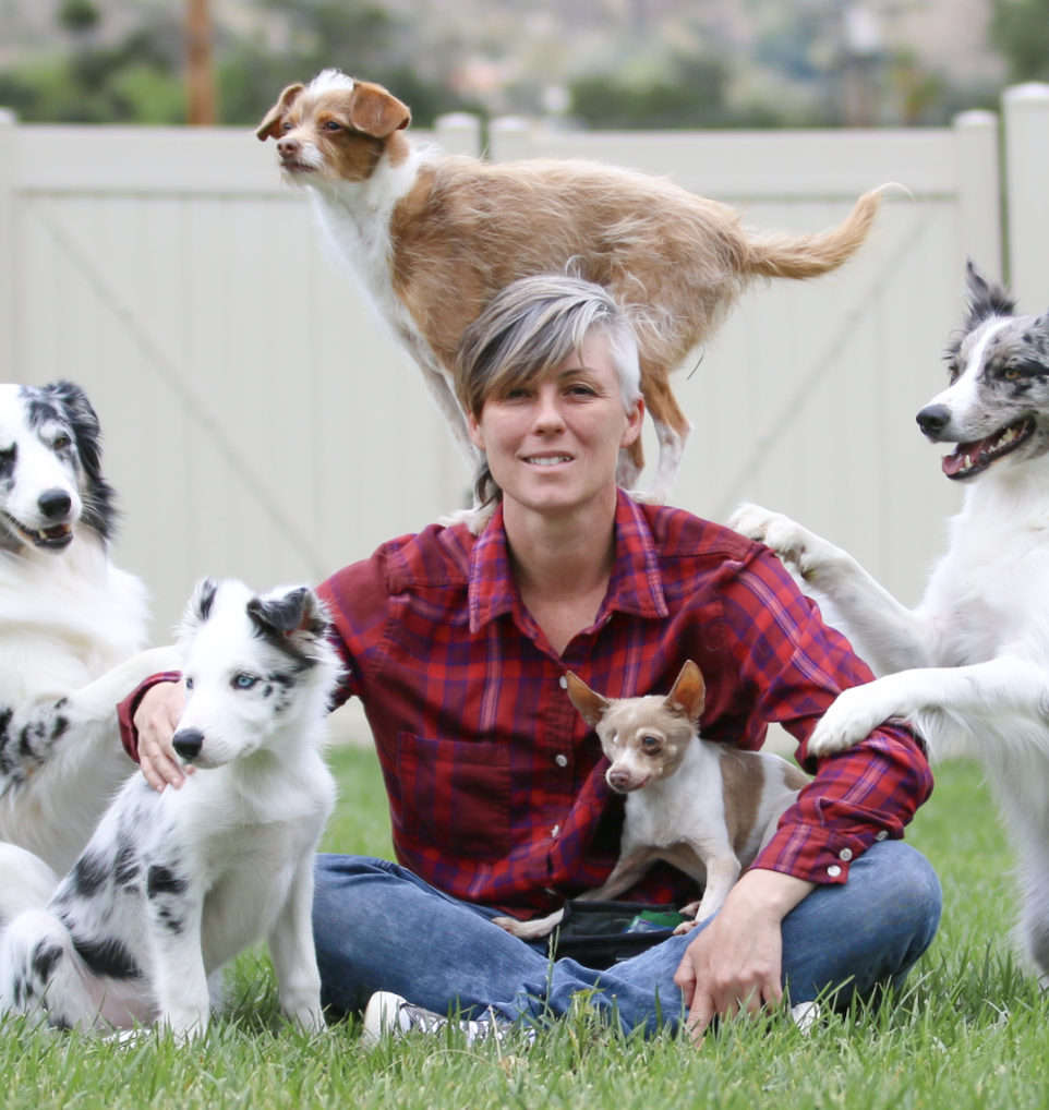 Emily Larlham sitting with dogs